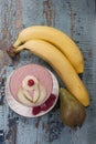 Smoothies of pear, banana and frozen raspberries with yogurt. Royalty Free Stock Photo