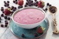 Smoothies of strawberries and irgi with yogurt in a ceramic bowl