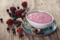 Smoothies of strawberries and irgi with yogurt in a ceramic bowl