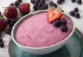 Smoothies of strawberries and irgi with yogurt in a ceramic bowl