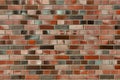 Smoothly flamed red-blue-colored Clinker brick wall and facade, facing brick glittering. Naturally burned shiny brick clinker text Royalty Free Stock Photo