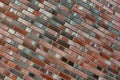 Smoothly flamed red-blue-colored Clinker brick wall and facade, facing brick glittering. Naturally burned shiny brick clinker text Royalty Free Stock Photo