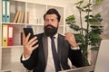 SMS alert for business marketing. Bearded man read SMS in smartphone. SMS message. SMS service. Text messaging. Business
