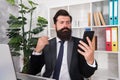 SMS alert for business marketing. Bearded man read SMS in smartphone. SMS message. SMS service. Text messaging. Business