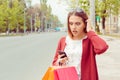 SMS. Closeup portrait funny shocked anxious scared young girl Lady looking at phone seeing bad news photos bully message with