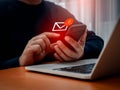 SMS spam, fake text message phishing from scammer concept. System hacked red warning alert, email hack, scam malware spreading