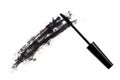 Black wand and smudged mascara on white background Royalty Free Stock Photo