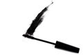 Black wand and smudged mascara on white background Royalty Free Stock Photo