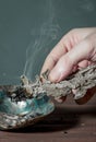 Smudging sage on abalone shell. Copy space for text. Burning sage creates fragrant smoke. Native American tradition. It can be use