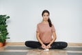 Smug woman practicing yoga, doing butterfly asana, turnig soles upward Royalty Free Stock Photo