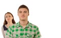 Smug young man being watched by his girlfriend Royalty Free Stock Photo