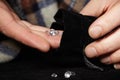 Smuggler of diamonds evaluating gems for dealing on velvet pad
