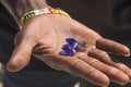 Smuggler showing smuggled precious and semi precious stones excavated in illegal mine