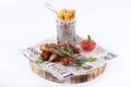 Snack aromatic crispy potato wedges and ribs barbecue with ketchup. Snacks on white background.