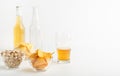 Snack and beer. Chips, pistachios and nachos in plates, half a glass of beer, full bottle and empty bottle Royalty Free Stock Photo