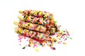 Snack biscuit sticks coated with rainbow sugar isolated on white Royalty Free Stock Photo