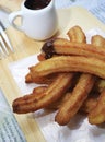 Snack churros pastry & coffee table Royalty Free Stock Photo