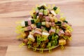 Snack of cucumbers, mushrooms and ham on skewers