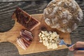 Snack with delicious South Tyrolean smoked bacon and cheese with flat bread lying on a rustic table Royalty Free Stock Photo