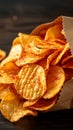 Snack indulgence Spicy BBQ potato chips, thin slices in open bag