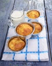 Snack muffins,salty snack cakes muffins with cheese on a wooden plate,a glass of fresh milk
