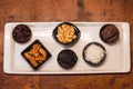 Snack plate of dried fruits, such as dates, on a white plate Royalty Free Stock Photo