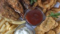 Snack platter - cheese sticks, chicken nugget, onion rings, french fries mix of snacks and sauces . Beer board Royalty Free Stock Photo