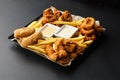 Snack platter - cheese sticks, chicken nugget, onion rings, potato croquette mix of snacks and sauces . Beer board. Horizontal Royalty Free Stock Photo