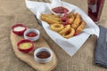 Snack platter - French fries,  spring rolls, fried sausage, chicken nugget, Turkish pastry, onion rings, potato croquette on plate Royalty Free Stock Photo