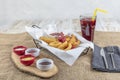 Snack platter - French fries,  spring rolls, fried sausage, chicken nugget, Turkish pastry, onion rings, potato croquette on plate Royalty Free Stock Photo