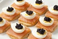 Snack with salmon,quail eggs and lumpfish roe Royalty Free Stock Photo
