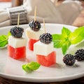 Snack on skewers of watermelon slices, cheese