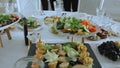 Snack table. Canapes with vegetables and cheese, Served table with food. Lots of snacks on the holiday table. Banquet Royalty Free Stock Photo