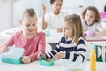 Snack time in a kindergarten class. Children opening their mint Royalty Free Stock Photo