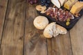 Snack to wine. Fresh baked bread. Different snack for wine. Cheese, olives, grapes copy space. flat lay. Royalty Free Stock Photo