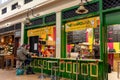 Snack Wallah Indian food stall in The Grainger Market with people eating and serving Royalty Free Stock Photo