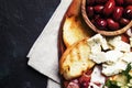 Snacks or antipasti, crostini, prosciutto, blue cheese and olive