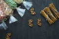 Snacks for beer, nuts and crackers. Oktober Fest. Beer snacks. Dark wooden background. Space for text Royalty Free Stock Photo