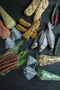 Snacks for beer. Set for beer. Nuts, crackers, fried potatoes in strips. View from above. Dark wooden background Royalty Free Stock Photo