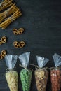 Snacks for beer. Set for beer. Nuts, crackers, fried potatoes in strips. View from above. Space for text. Dark wooden background Royalty Free Stock Photo