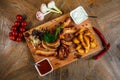 Snacks for beer are on a wooden tray. October fest