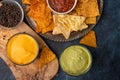 Snacks and different types of chips with dip, salsa, top view, rest and snacks for beer Royalty Free Stock Photo