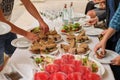 snacks, sandwiches, drinks at the buffet. guests help themselves Royalty Free Stock Photo