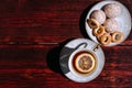 Snacks and sweets for tea in a small white saucer. Beautiful tea set. White ceramic Cup of tea with lemon on a wooden table Royalty Free Stock Photo