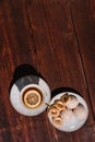 Snacks and sweets for tea in a small white saucer. Beautiful tea set. White ceramic Cup of tea with lemon on a wooden table Royalty Free Stock Photo