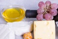 Snacks with wine - bottle, various types of cheeses, figs, nuts, honey, grapes Royalty Free Stock Photo