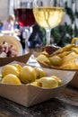 Snacks and wine in a tapas bar. Olives and pinchos with wineglasses Royalty Free Stock Photo