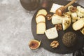 Snacks with wine - various types of cheeses, figs, nuts, honey, Royalty Free Stock Photo