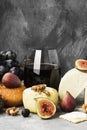 Snacks with wine - various types of cheeses, figs, nuts, honey,