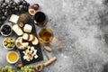 Snacks with wine - various types of cheeses, figs, nuts, honey,